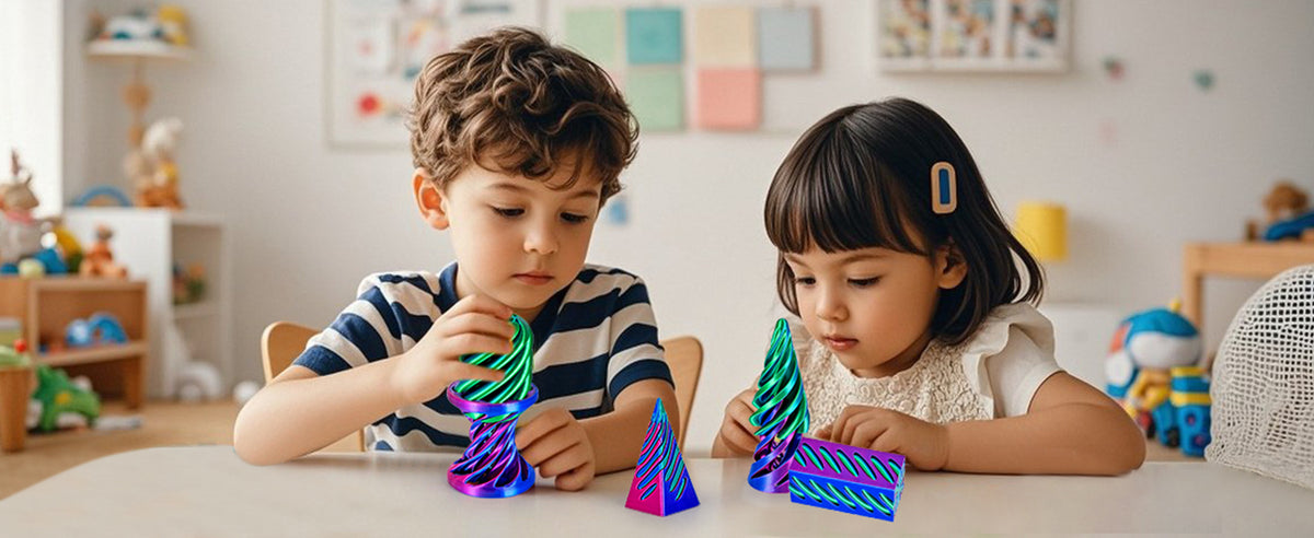 Two children are playing with a set of 3D printed spiral fidget toys.