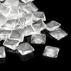 A pile of clear, square decorative refrigerator magnets for custom crafts.