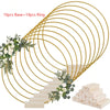 A set of 10 gold metal hoop centerpieces with stands arranged in a circular pattern.