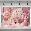 A pink castle backdrop for a birthday party featuring fairy lights and balloons against a soft pink cloud background.