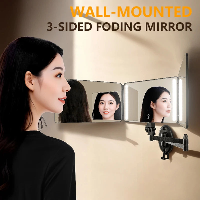 A woman is looking into a wall-mounted 3-sided foding mirror with an LED light, showing her reflection.