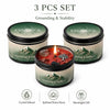 A set of three Evoduck grounding and stability candles in black tins, featuring crystal infused scents for spiritual home dec