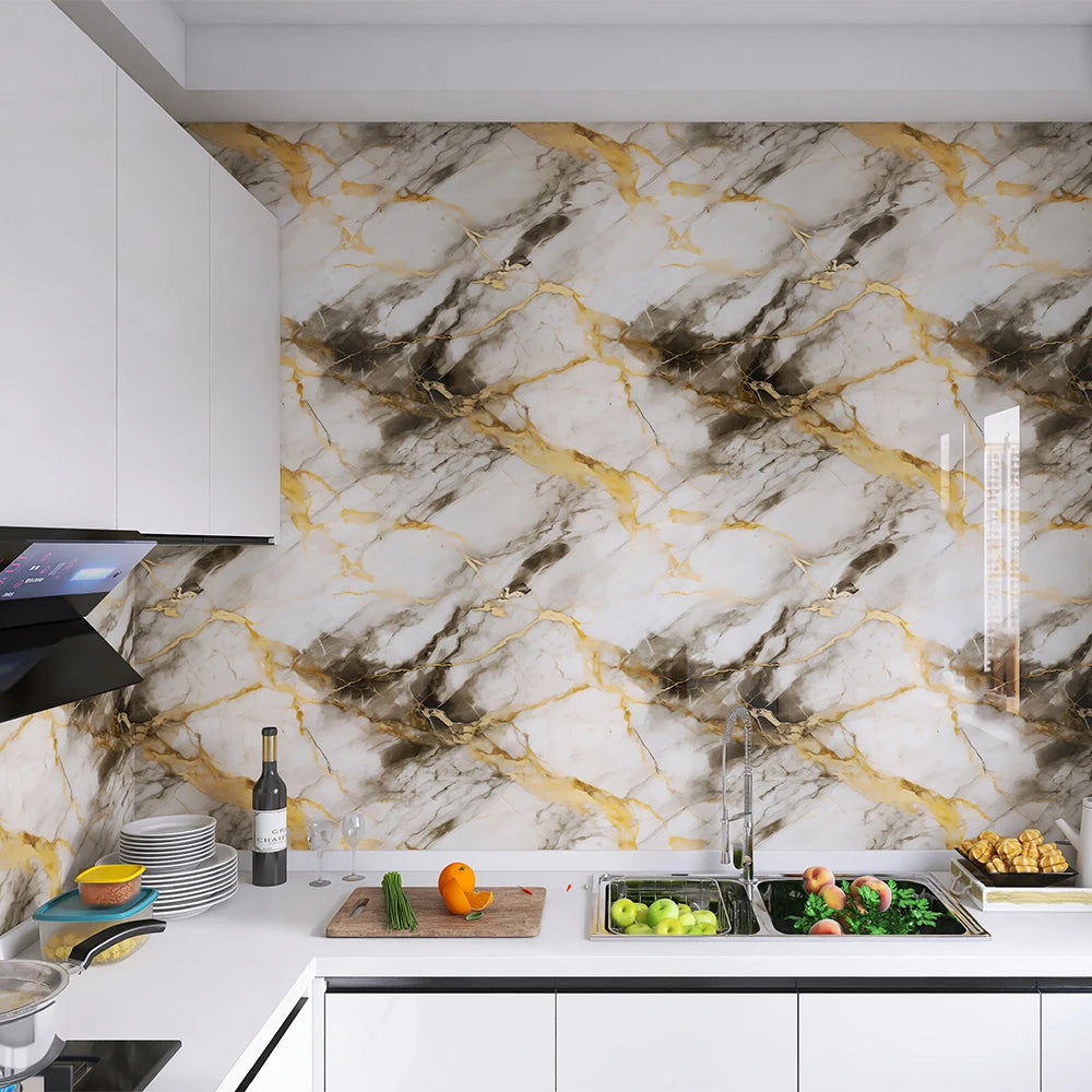 A kitchen countertop featuring a marble pattern self-adhesive backsplash panel with gold veining and gray background.