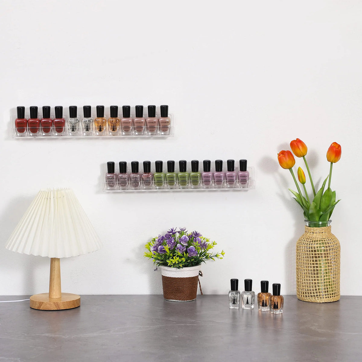 A display of various colored bottles arranged on clear acrylic floating shelves against a white wall.