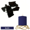 Black candle in a gold wire holder with black dye blocks nearby