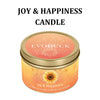 A jar of Joy & Happiness candle with a sunflower design on the label.