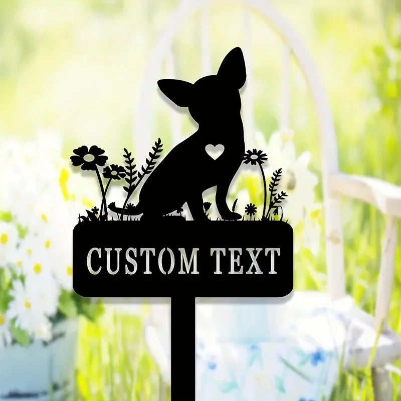 A silhouette of a chihuahua dog sits on a garden stake with custom text, set against a bright green and yellow outdoor backgr