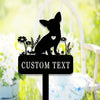 A silhouette of a chihuahua dog sits on a garden stake with custom text, set against a bright green and yellow outdoor backgr