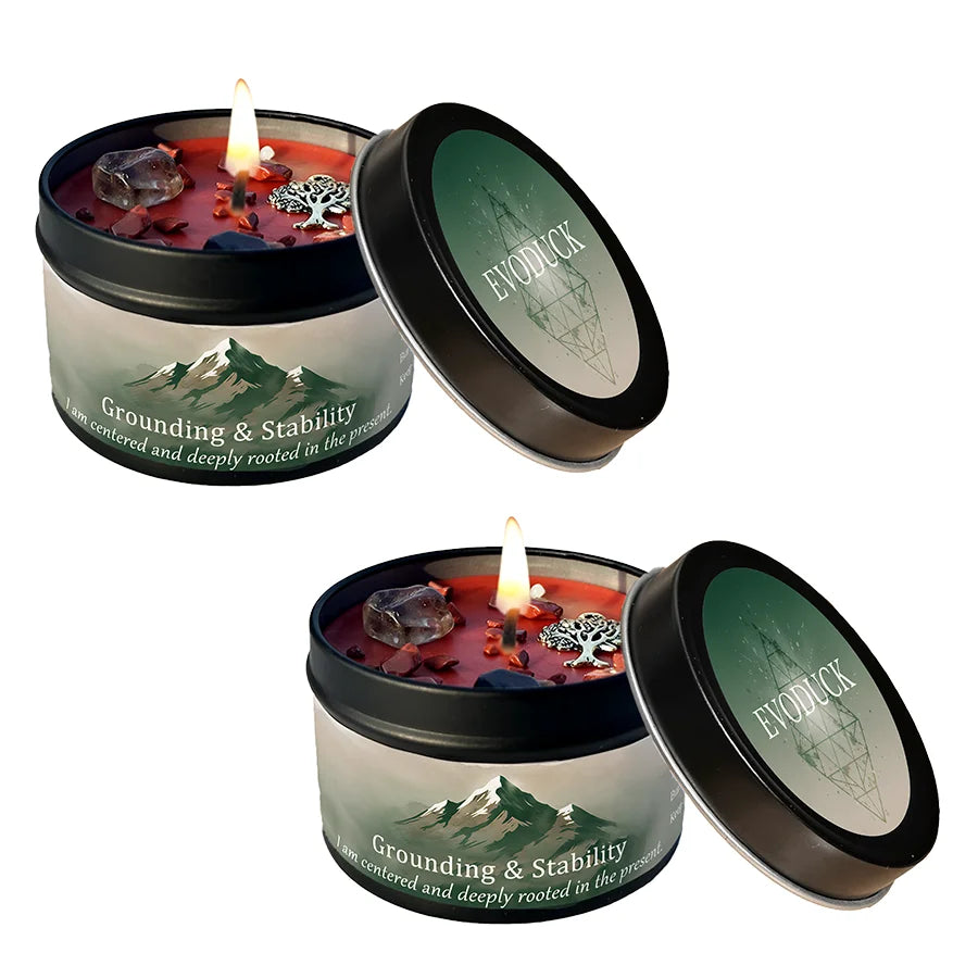 A set of two candle jars featuring a grounding crystal intention candle with Vetiver and Cedarwood scents.