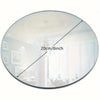 Round acrylic mirror showing a room interior with a chandelier and light.