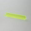 A long, narrow, translucent lime green acrylic floating shelf mounted on a white wall.