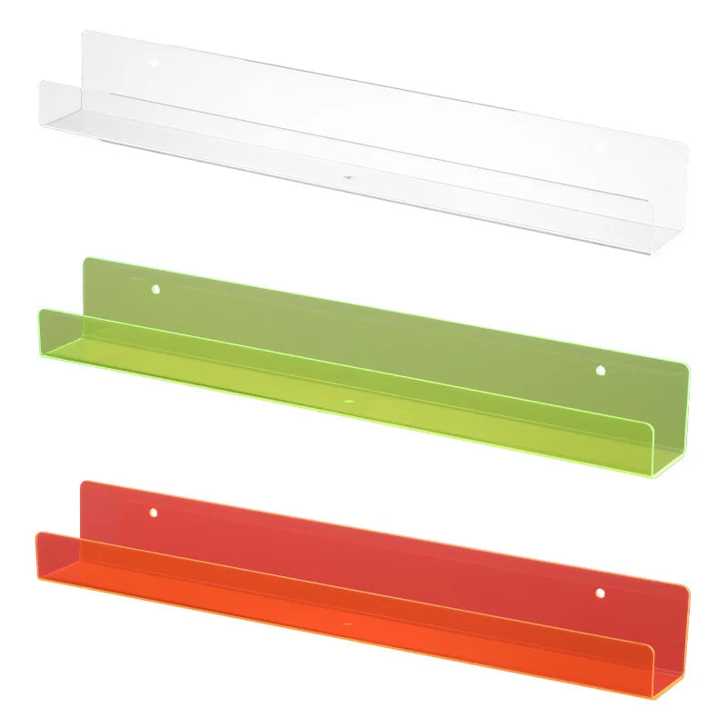 Clear acrylic floating shelf for books and display, shown in transparent, lime green, and red colors.