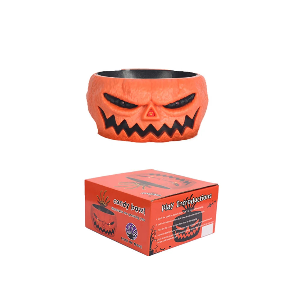 An orange, carved pumpkin shaped bowl with a menacing face and black accents.