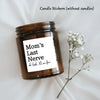 A dark glass jar with a white label reading Mom's Last Nerve oh look it's on fire, resting on a white cloth with a sprig of b