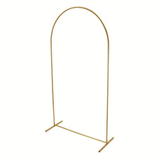 A slender, gold-colored metal arch stand designed for events and celebrations.