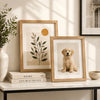 A collection of wooden photo frames featuring botanical and pet portraits displayed on a white shelf.