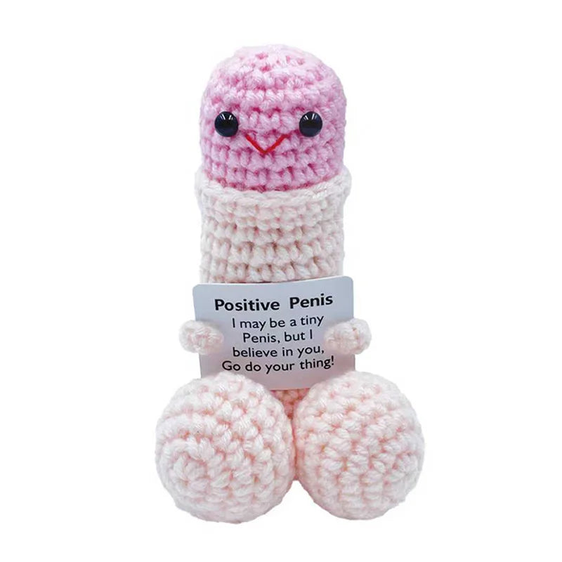 Pink crochet figurine of a penis with black eyes