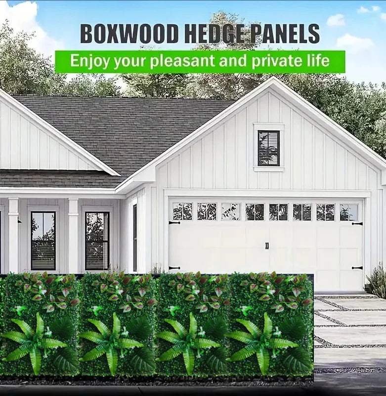 A white house with a garage and a green artificial hedge panel in the foreground.
