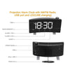 A black projection alarm clock with an LED display showing 18:30, featuring AM/FM radio and a USB port.