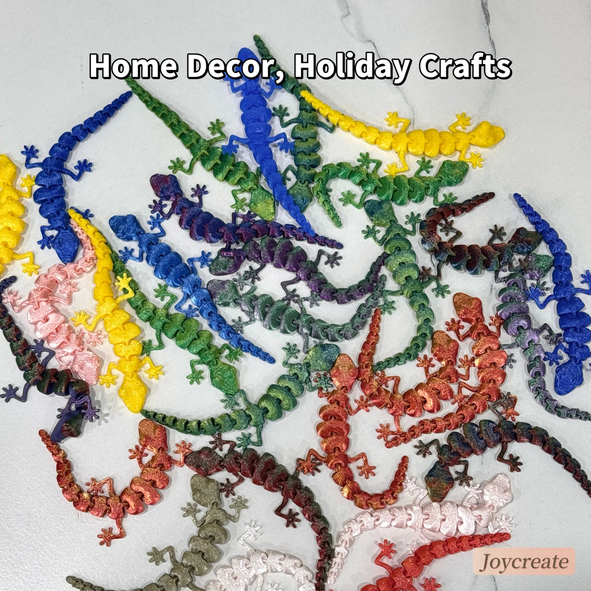 A collection of colorful 3D printed articulated lizard figurines used for home decor and holiday crafts.