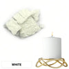 White candle dye blocks and a white pillar candle in a gold stand.