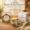 Evoduck Saint Jude Thaddeus prayer tin candle and guide in a gift box on a wooden surface.