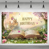 A beautiful birthday backdrop featuring an open book surrounded by pink and purple flowers and butterflies under a blossoming