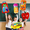 A group of children holding a large orange school bus foil balloon and an apple in front of a chalkboard.