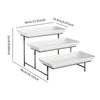 A black metal three-tier rectangular serving platter stand with white serving trays.
