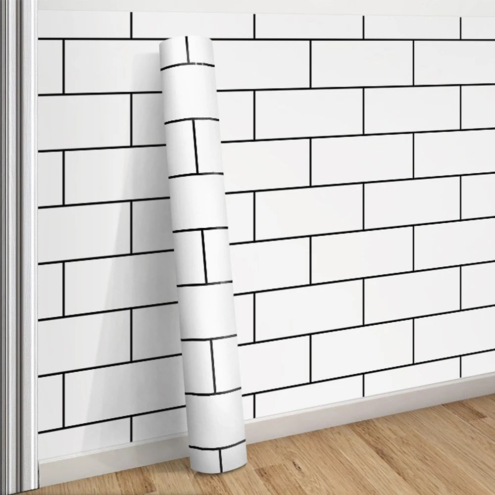 A roll of white and black grid peel-and-stick wallpaper mounted on a wall.