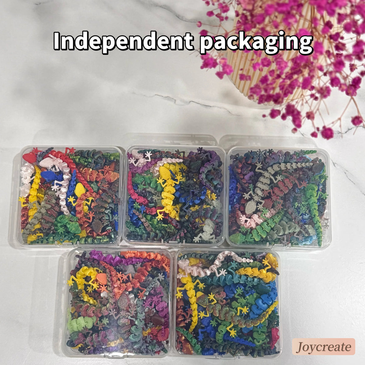 A collection of independent packaging containing 30 small, colorful lizard figurines.