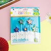 A pack of colorful star-shaped birthday candles with a yellow crown design on the packaging.