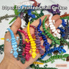 A hand holds a collection of 30 small 3D printed gecko figurines in various colors and shades.