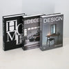 A set of three modern decorative fake books titled Home Decor Design and Design Concept on a white surface.