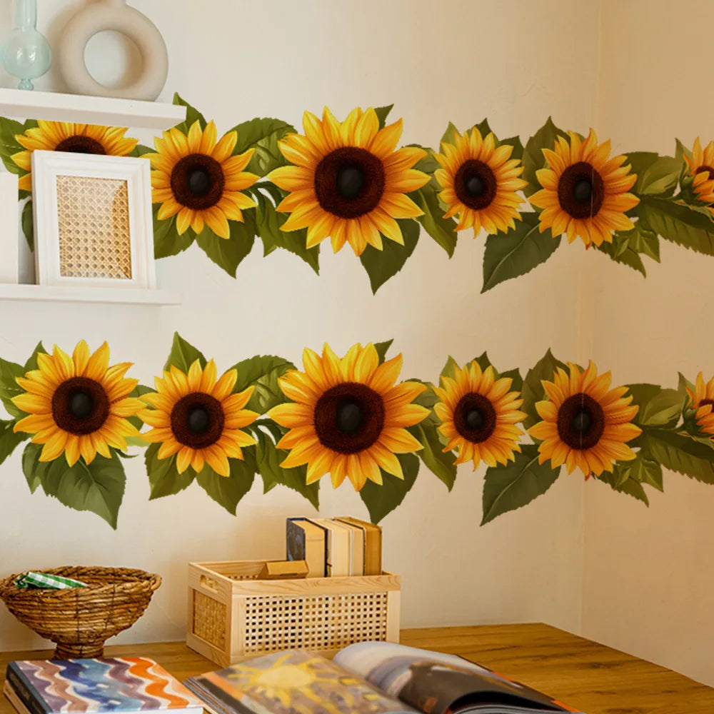 A display of pastoral sunflower wall stickers featuring bright yellow and dark brown flowers on a white wall.