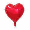 A glossy red heart-shaped foil balloon used for celebrations.