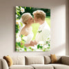 A framed canvas wall art featuring a blonde woman and a man kissing in a bright, green outdoor setting.