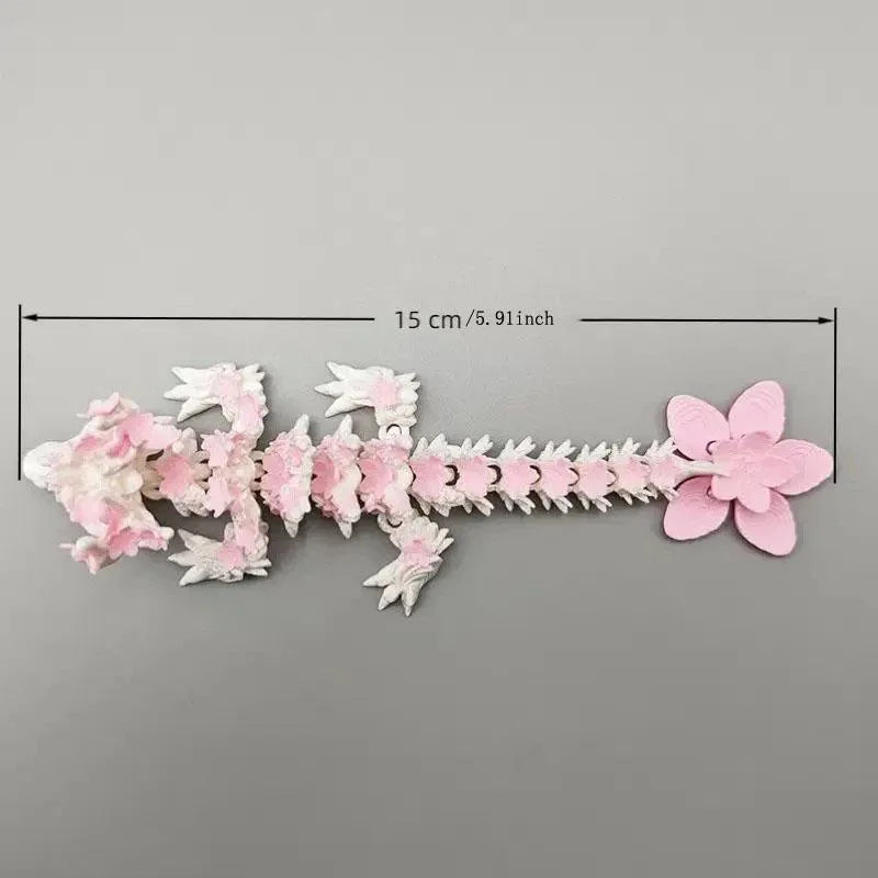 A delicate miniature figurine of a dragon made from pink cherry blossoms, measuring 15 cm long.
