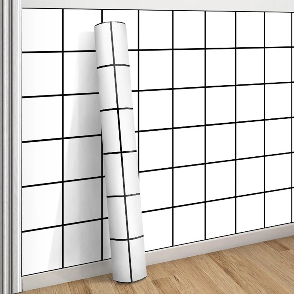 A roll of white grid peel-and-stick wallpaper mounted on a wall with a grid pattern.