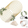 A set of ten gold metal hoop centerpieces with stands, featuring various sizes and styles.