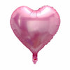 A pink heart-shaped foil balloon used for celebrations.