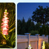 Four colorful solar-powered delphinium flower lights illuminating a garden pathway at dusk.