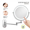 A round LED makeup mirror with a magnifying feature and USB charging port mounted on a wall.