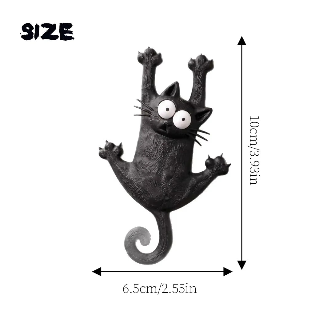 Schwarze magnetische Katzenfigur mit Schnurrhaaren und gekrümmtem Schwanz neben einer Größenskala.