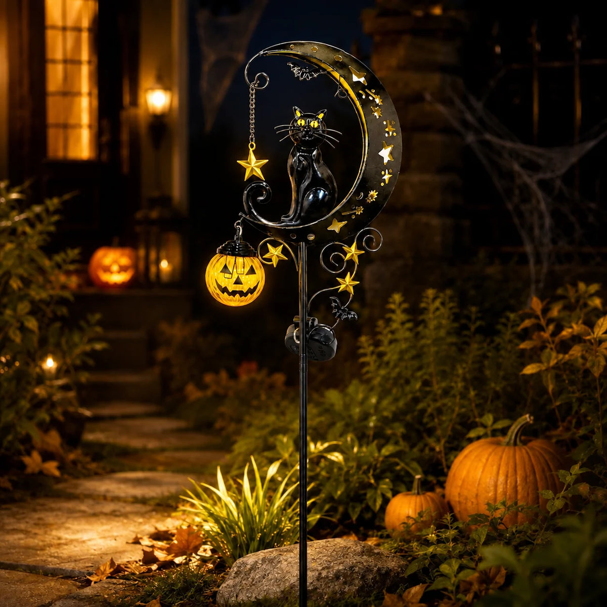 A Halloween solar garden stake light featuring a black cat moon pumpkin lantern with glowing elements.