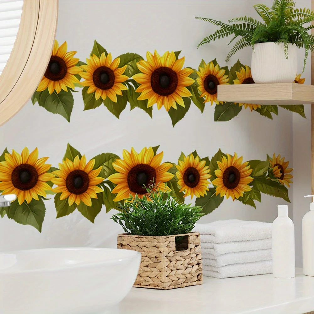 A set of two pastoral sunflower wall stickers featuring bright yellow and green leaves displayed on a white shelf.