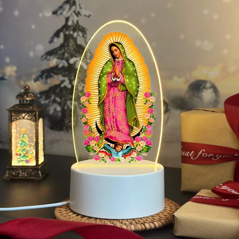 Acrylic LED night light of Our Lady of Guadalupe with a glowing halo and floral border on a white base