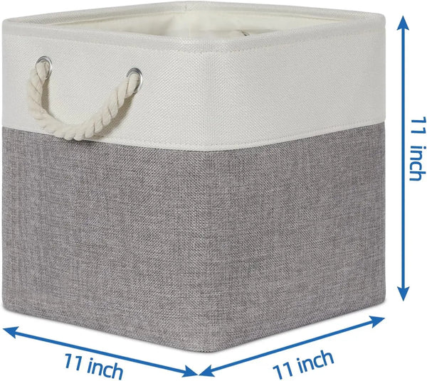 A set of four fabric storage cubes with metal frames, featuring a light cream top and a gray bottom.