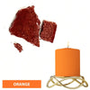 Orange candle dye blocks next to an orange pillar candle.