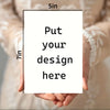 A hand holds a blank card template with dimensions marked, ready for a custom design.